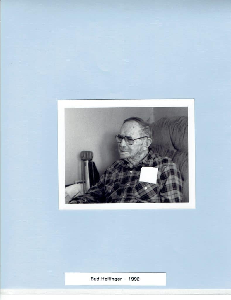 A black and white photo shows an older man in glasses and a plaid shirt, seated, with "Bud Hollinger - 1992" below.