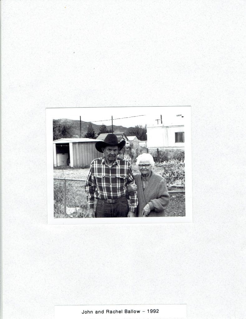A black and white photo of a man in a cowboy hat and a woman with glasses, "John and Rachel Ballow - 1992".