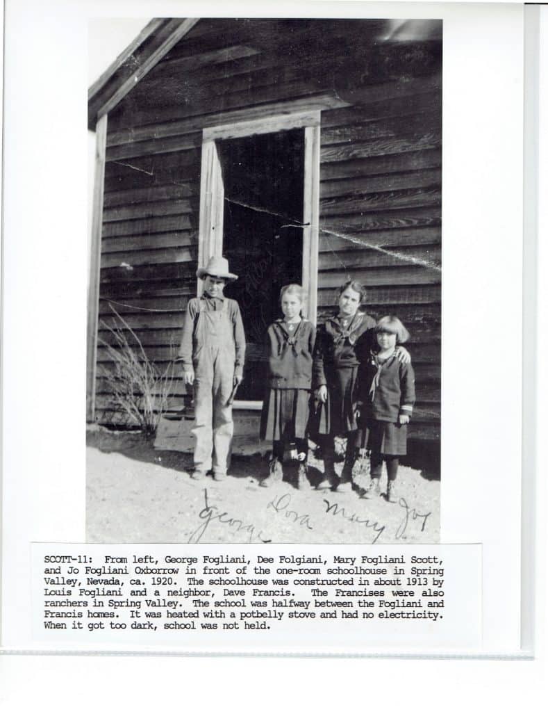 Four children stand in front of a wooden schoolhouse, with "George Dora Mary Joy" signed below them.