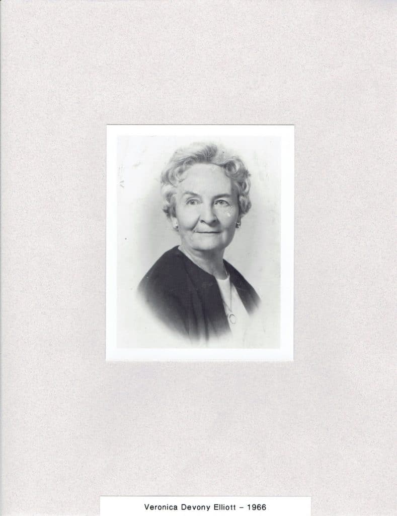 A black and white portrait shows an older woman with curly hair, smiling, with "Veronica Devony Elliott - 1966" below.